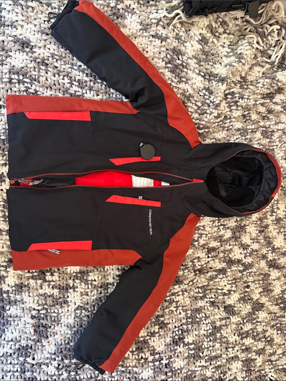 Obermeyer Black and Rust Red Hooded Kids snow jacket